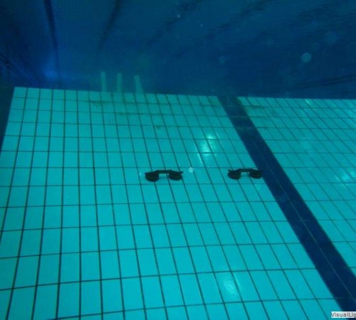 Tegelreparatie schuine wand duiklkuil Orka zwembadreparatie
